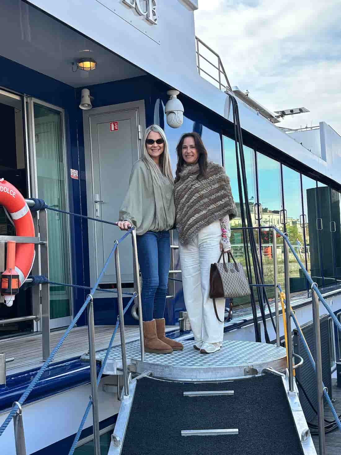 Travelers enjoying a private sunrise breakfast on a wooden boat at Cai Rang Floating Market, Vietnam.